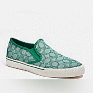 Coach Green slip on sneakers.